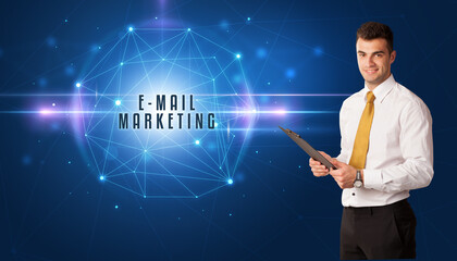 Businessman thinking about security solutions with E-MAIL MARKETING inscription
