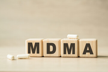 MDMA. THE WORD WRITTEN ON CUBES, PILLS . MEDICAL CONCEPT