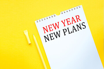 NEW YEAR NEW PLANS . Office workplace with supplies and reports. You can use in business, marketing and other concepts. Messege of the day.