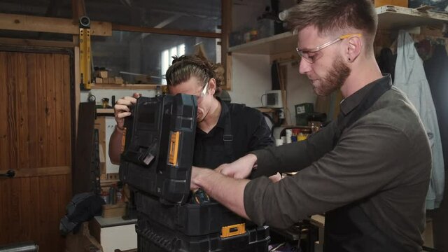 wood cutting and designing couple people woman restaurant young happy smiling two men wine drinking business friends drink sitting bar indoors menu love home table together