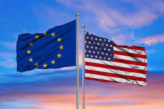 Relationship between the USA and the European Union. Two flags of countries on heaven with sunset. 3D rendered illustration.