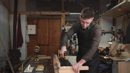 working in wood work wood worker working construction carpenter home portrait diy office tool house desk senior business people repair tools builder job carpentry person young saw sitting