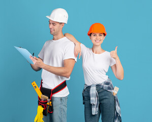 Repair Services. Workers Couple In Hardhats Holding Clipboard And Showing Thumb Up