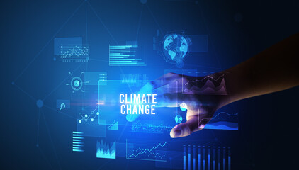 Hand touching CLIMATE CHANGE inscription, new business technology concept