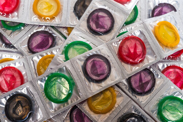 Colorful condoms background.