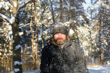 A frozen man  in winter sunny forest