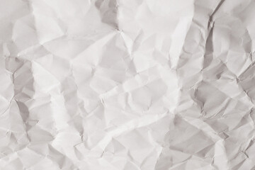 Crumpled white paper background.