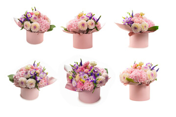 Pink and purple bouquet of flowers in a pink box isolated on white.