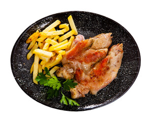 Appetizing fried pig legs with fries potatoes served on plate. Isolated over white background