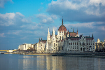 Fototapeta na wymiar Hungary Budapest, Parliament against the background of the dramatic sky, reflected in the water