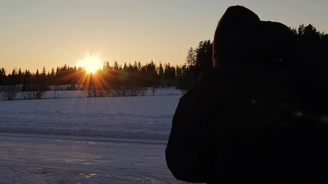 Taking photographs of the winter sunset in Sweden. Shot in 1080P