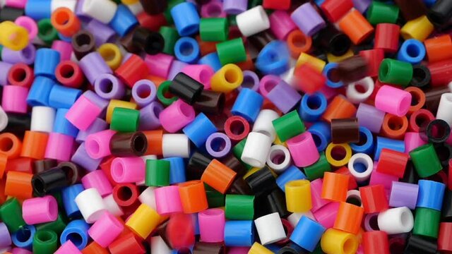 Colorful fusible plastic beads. Close up.