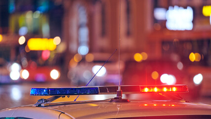 Police car lights at night city street
