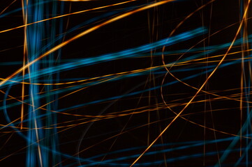 Luminous streamer - neon bright lines on black background.