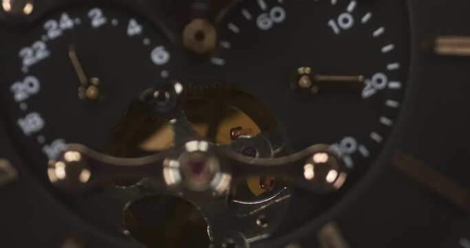 Mechanism, clockwork of a watch with jewels, close-up. Luxury background. Focus on the anker fork and anker wheel.