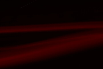 Luminous streamer - neon bright lines on black background.