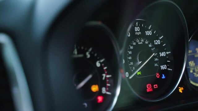 Dashboard of modern car turns on. Speedometer and tachometer with arrow