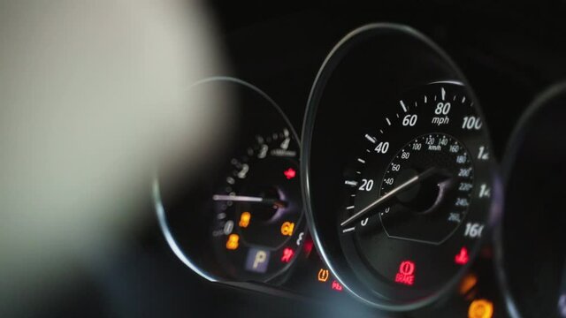 Modern car speedometer on dashboard