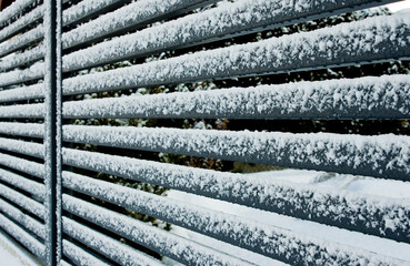 Modern metal fence detail in winter