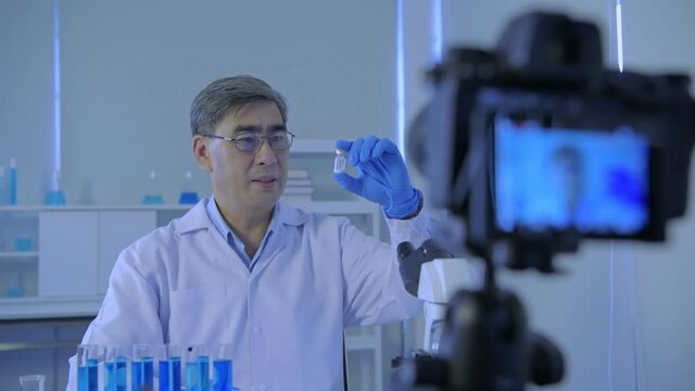 Research concept of 4k resolution. Scientists are interviewing and explaining the use of vaccines by cameras in the lab.