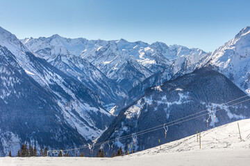 Empty drag lifts on snowy mountain - empty ski field