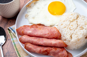Hamsilog (close up)- famous Filipino meal that consists of fried rice, egg and ham slices.