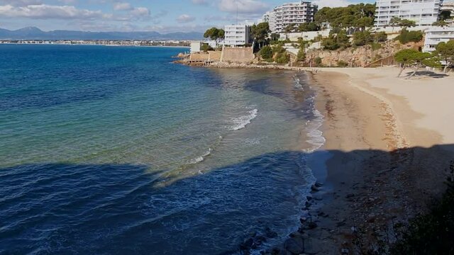 Waves crushing on the rocks in Platja dels Capellans
