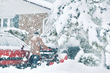 Montreal, Canada - Jan 16, 2021: Snow removing during a heavy storm