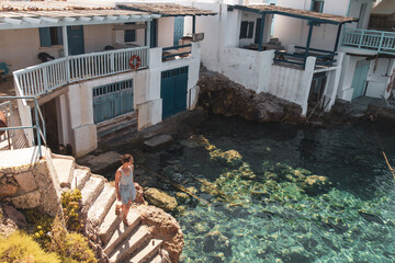 person in a fishing village on Milos island, Greece