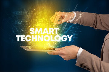 Close-up of a touchscreen with SMART TECHNOLOGY inscription, innovative technology concept