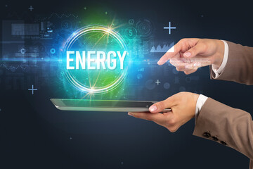 Close-up of a touchscreen with ENERGY inscription, new technology concept