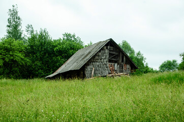 Fototapeta na wymiar abandoned house in a village beyond the hills .