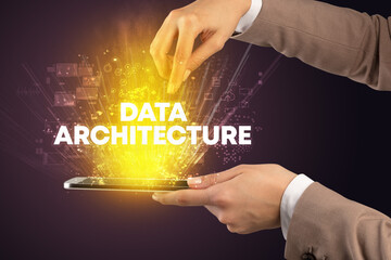 Close-up of a touchscreen with DATA ARCHITECTURE inscription, innovative technology concept