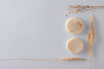 Natural herbal soap on a gray background with copy space. Zero waste concept.