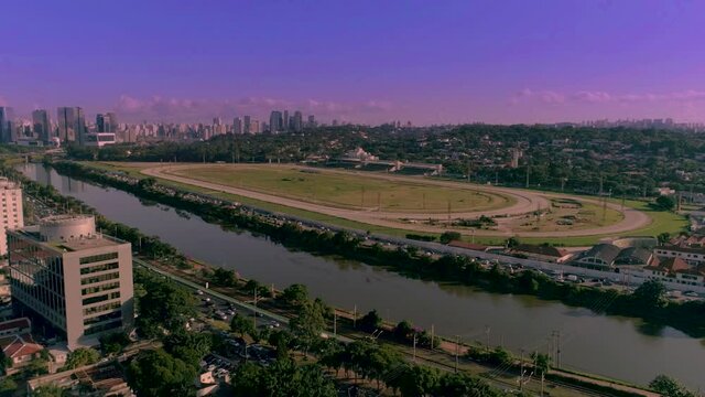 hyperlapse flight in Sao Paulo and view of Joquei Club and horse race tracks on a sunset