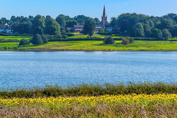 A view across Rutland Water reservoir towards the village of Edith Weston in summertime