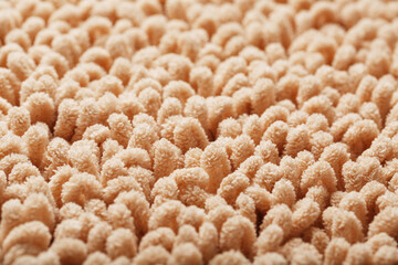 The structure of beige wool fibers in full screen as a background.