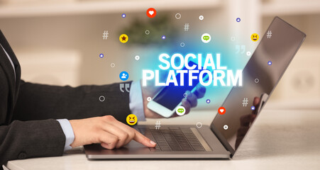 Freelance woman using laptop with SOCIAL PLATFORM inscription, Social media concept