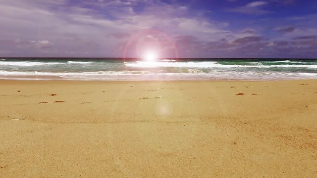 Cyan sea water n white foam ocean wave crashing summer sandy beach with bokeh sun light ray effect or sunlight lens flare on white cloud blue sky background, 4k cinemagraphs b-roll footage video