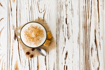 cup of cappuccino on table