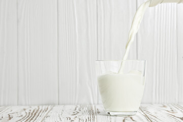 milk pouring into glass