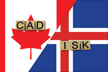Canada and Iceland currencies codes on national flags background