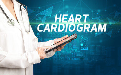 doctor writes notes on the clipboard with HEART CARDIOGRAM inscription, medical diagnosis concept