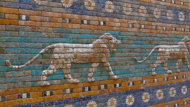 Beautiful glazed tiled bricks bas relief, decoration on ancient walls of Ishtar Gate of Babylon with images of Mesopotamian lions symbolizing the goddess, diagonal perspective, zoom in and pan, close 