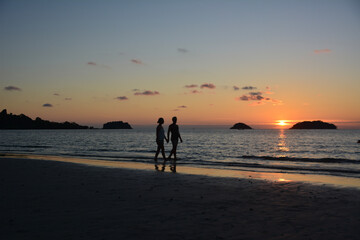 couple during sunset on the beach on Koh Chang, Thailand