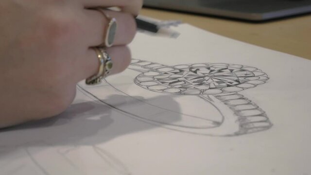 Close up designing a custom wedding ring sketch 4