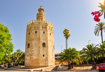 Fototapeta na wymiar Tower of Gold (Torre del Oro) on Seville embanmkent, Spain