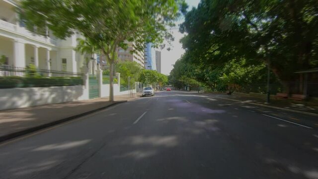 Rear Facing Driving Point Of View POV Of City Central Business District CBD, With Tree-lined Avenue, Colonial Buildings And City Intersections - Ideal For Interior Car Scene Green Screen Replacement