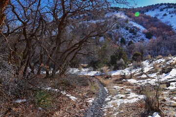 Winter snow mountain hiking trail views Yellow Fork Canyon County Park Rose Canyon by Rio Tinto Bingham Copper Mine, in winter. Salt Lake City, Utah. United States.