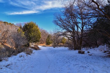 Winter snow mountain hiking trail views Yellow Fork Canyon County Park Rose Canyon by Rio Tinto Bingham Copper Mine, in winter. Salt Lake City, Utah. United States.
